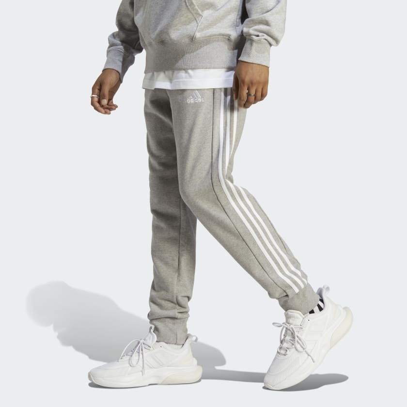 Essentials_French_Terry_Tapered_Cuff_3-Stripes_Pants_Szary_IC9407_21_model
